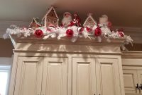 Christmas decor above kitchen cabinets